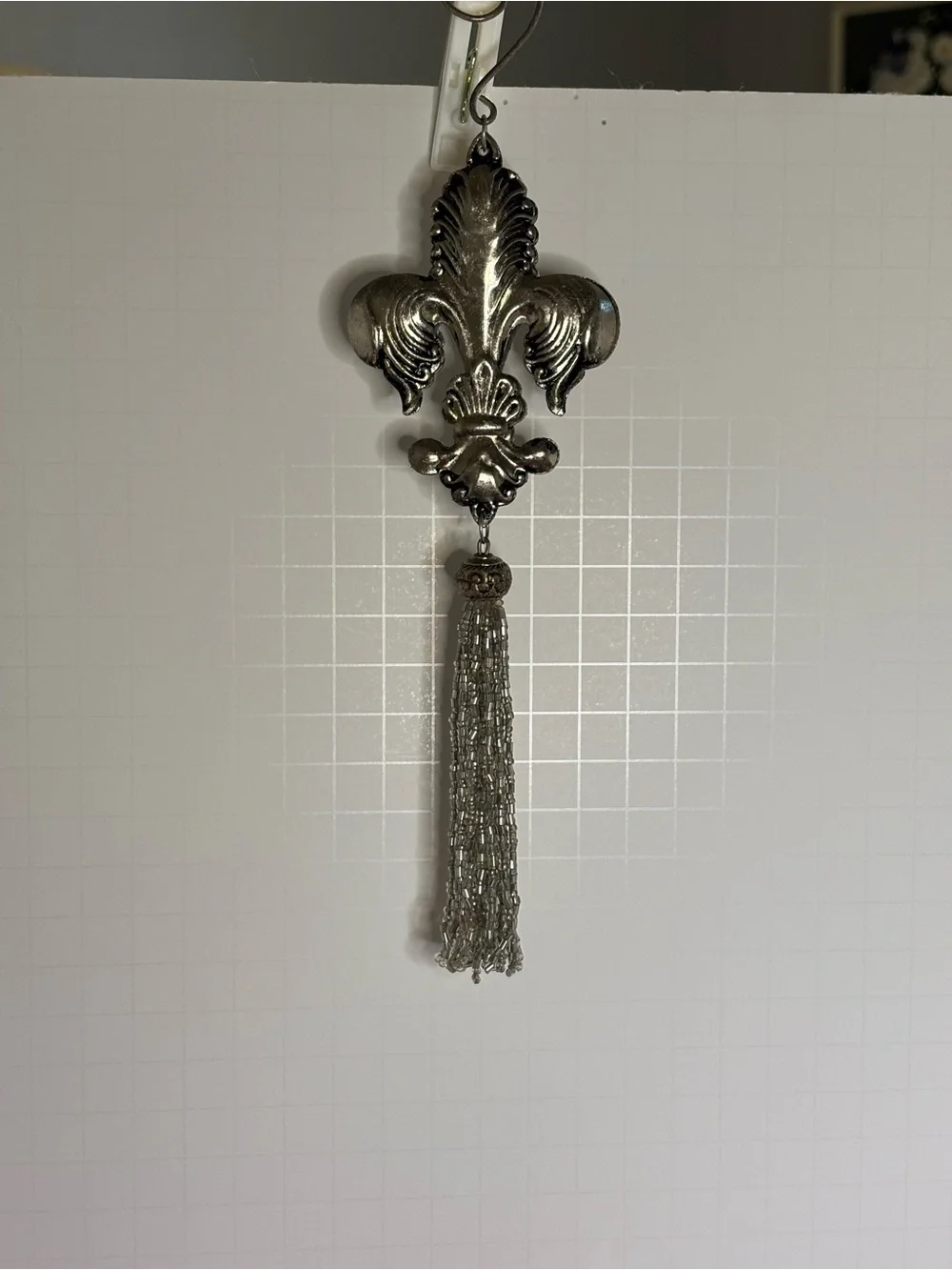 Metal Fleur-de-Lis Hanging Ornament with Silver tone Tassel
